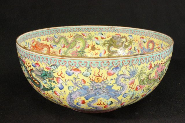 Chinese Eggshell Porcelain Bowl: Yellow ground with dragon motif. Approx. 9 3/4" D x 4 1/4" H.