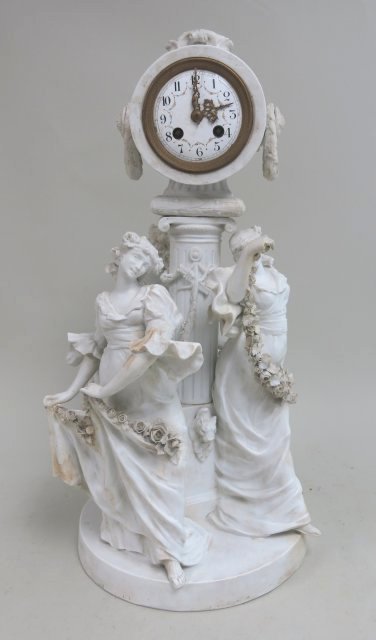 L. Marti, Parian figural clock: Médaille d'argent, 1889. Depicting three maidens with flowers dancing around base of clock. Circa 19th century. Approx. 22" H x 12" D. (4110). Losses.
