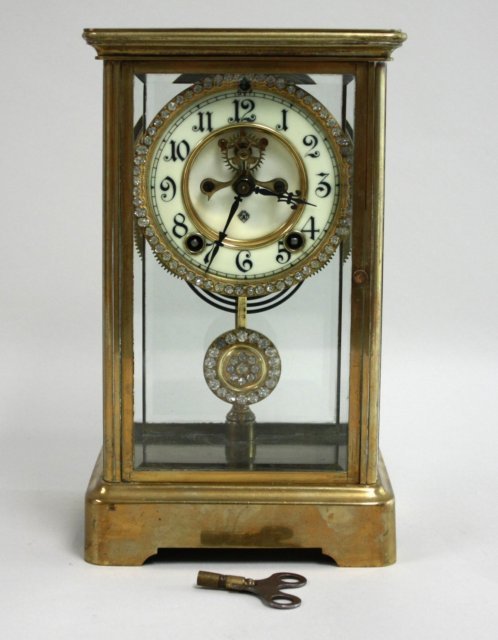 Ansonia Clock: With key & pendulum. Approx. 11" H x 6 1/4" W x 5" D.