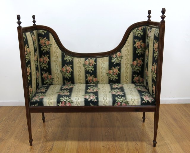 Edwardian style Love Seat: Floral upholstery. Mahogany, pencil inlays. Four flare finials. Approx. 51" H x 49 3/4" W x 20 3/4" D. Back loose otherwise clean