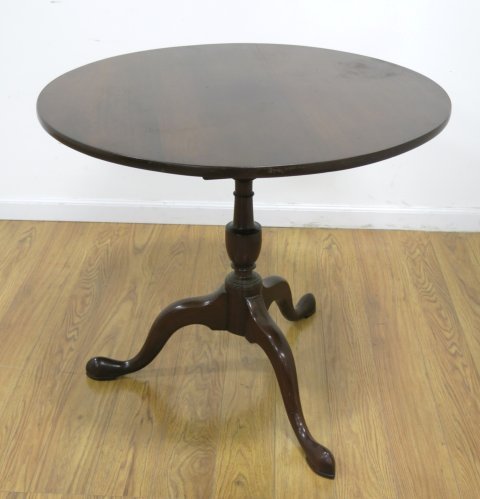 Round Mahogany Tilt Top Table: 19th century. Birdcage center. Paw foot. Approx. 28 1/2" H x 32 3/4" diameter. (4221)