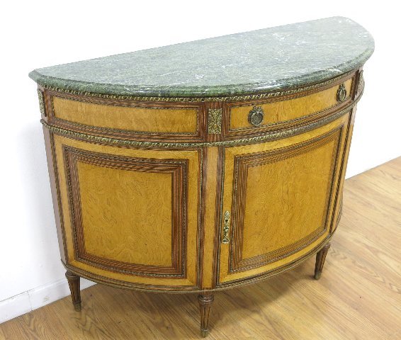 Marble Top Demilune Commode with Bronze Trim: Approx. 34" H x 47 1/2" W x 18 1/2" D.