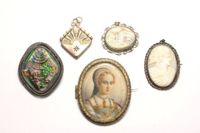 Lot of Cameos and Brooches: Including mother of pearl cameo, scenic cameo, miniature portrait brooch, enamel brooch/pendant .800, locket with diamond chip. 5 pieces total. Miniature portrait brooch with line.