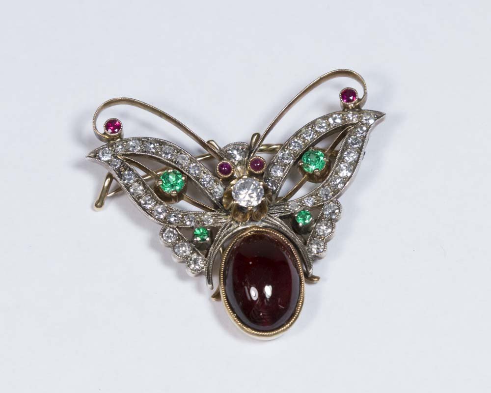 Russian Antique Brooch: With almandine, diamonds, and emeralds. Marked 0.56.