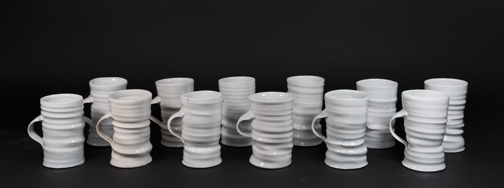 James Makins 12 Porcelain Mugs: Largest approx. 5 1/2" H. One cracked.