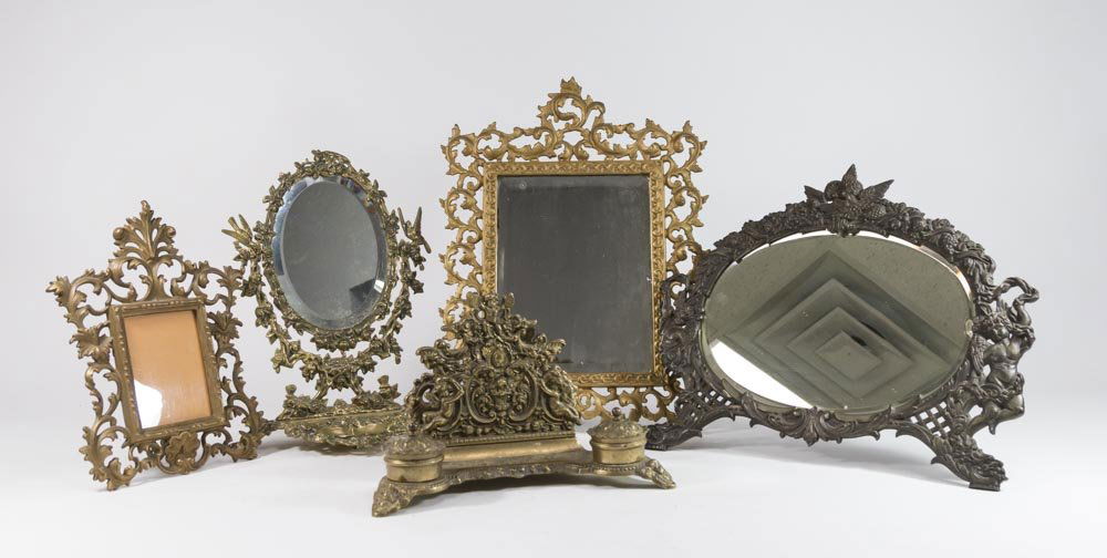5 Brass & Bronze Items: Including inkwell with letter holder; 3 picture frames, 2 with mirrors; and table mirror with ring holder. Victorian style. Largest approx. 17 3/4" H x 13 1/4" W.
