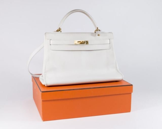 Hermès White Calf Leather "Kelly" Bag: 32 cm. Gilt hardware. Approx. 10" H x 14" W x 5" D.