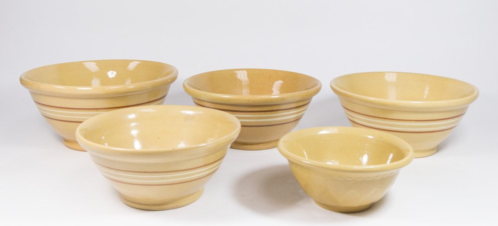 5 Yellow Ware Batter & Mixing Bowls: Batter bowl approx. 5 3/4" H x 12 3/4" D; mixing bowl approx. 5" H x 11 5/8" D; mixing bowl approx. 5 1/4" H x 11 1/2" D; mixing bowl approx. 4 1/2" H x 10 1/2" D; craquelure 3 1/2" H x 8 1/4" D. Batt