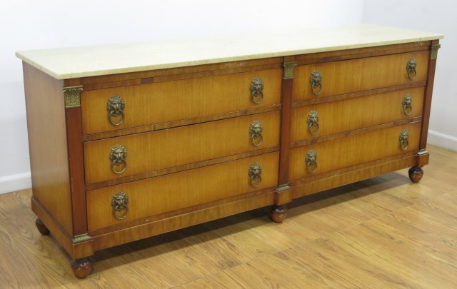 Grosfeld House 6-Drawer Marble Top Dresser: Lion brass pulls. Bronze mounts. Approx. 31" H x 77" W x 20" D. Veneer losses and marble cracked.