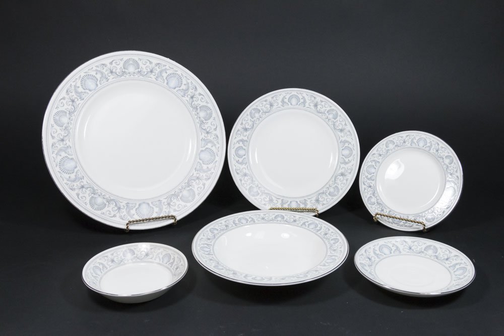Wedgwood Porcelain Dolphins Dinnerware: R4652. Including 13 dinner plates, 16 soup bowls, 16 salad plates, 18 saucers, 18 bread and butter plates, and 18 berry plates. 99 pieces total. From the 40-year personal collection of a retiring anti