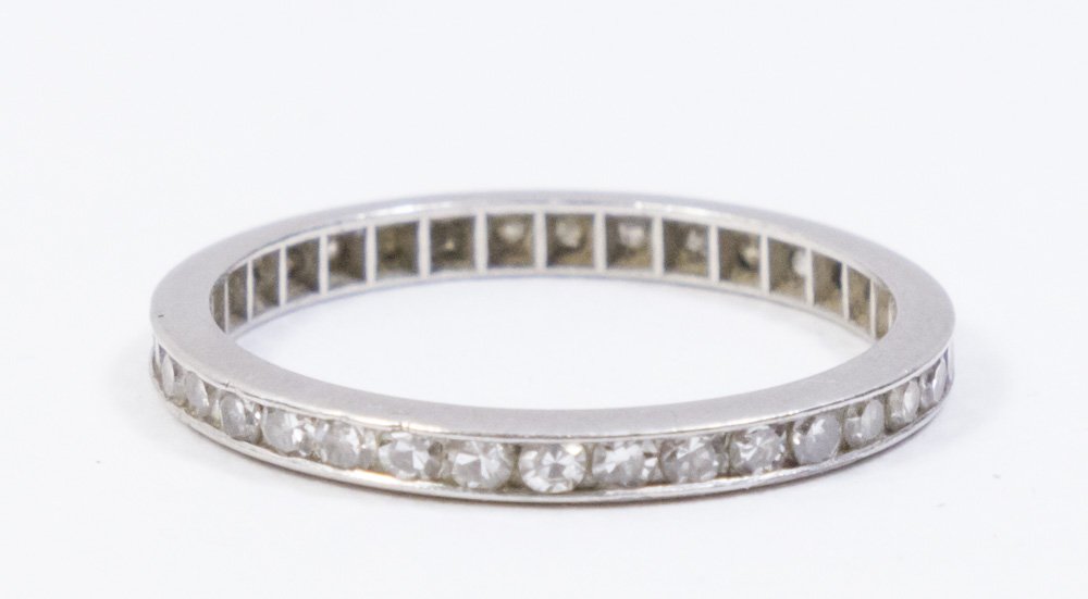 Platinum & Diamond Eternity Wedding Band: Approx. 1.3 dwt, 2 grams. Approx. size 6 1/2.