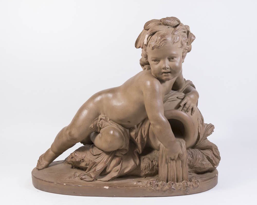Terracotta of Reclining Cherub with Vase: Approx. 17" H x 22 1/2" W. Contents of a North Shore, Long Island home. Chip on head and edge.