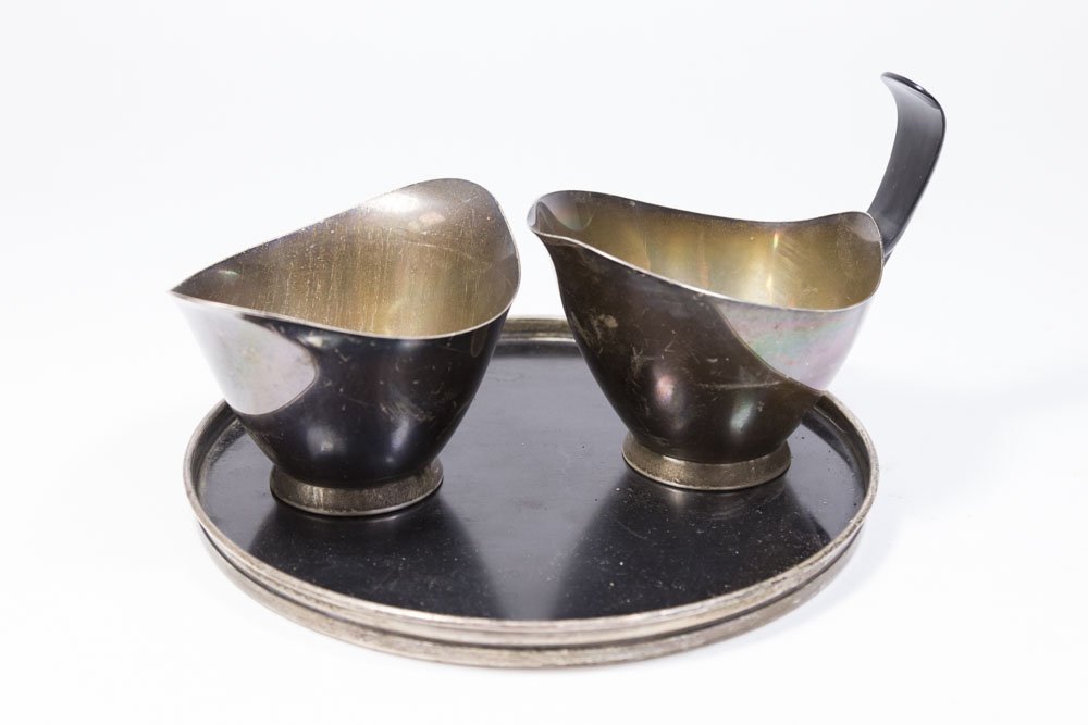 3 Piece Gorham Donald Colflesh Sterling Silver Set: Sterling silver and plastic. Including creamer, sugar, and tray. Creamer and sugar approx. 7 ozt, 222 grams. Tray approx. 7 1/4" diameter.