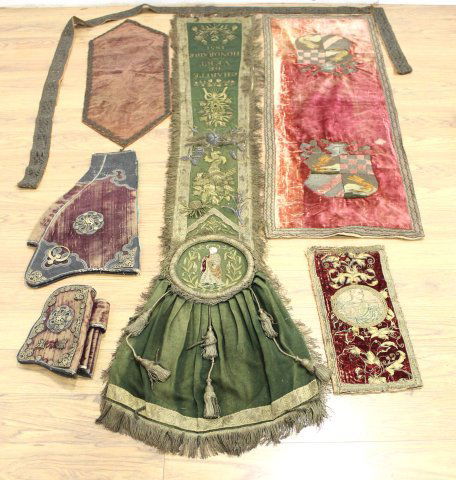 Group 5 Embroidered Metal Thread Panels & Borders: Largest approx. 72" L. 1 embroidered Charité de Vert Honoraire 1851. 1 with 2 coats of arms. With a renaissance style metal mounted velvet saddle holster. Approx. 29 1/4" W.