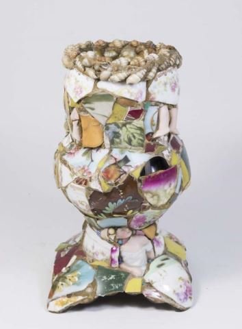 :Memory Vase: Pieces of shell and broken porcelain. Approx. 10" H. From the Gloria Crest estate.
