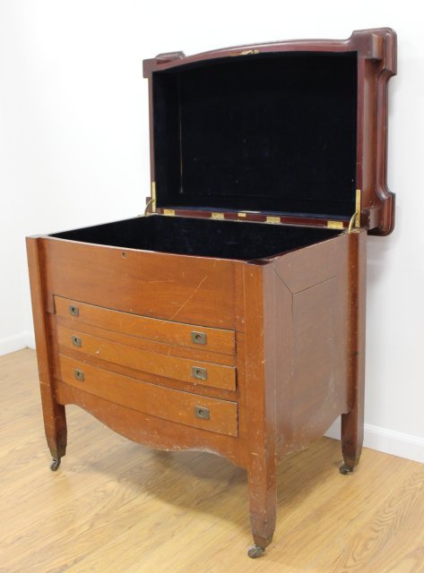 Mahogany Lift Top Silverware Chest: On wheels. Approx. 36" x 38" x 24 1/2".