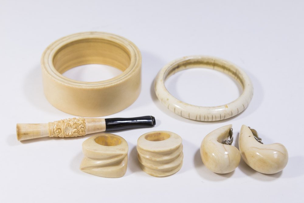 Bone Jewelry Lot, Bracelets, Earrings, Rings: Including bone bangle bracelet, approx. 1-1/8"; thin bone bangle bracelet; 2 rings; 1 pair earrings; and 1 carved bone cigarette holder. From a NYC estate. (1-5163) Thin bracelet, rings, and earrings 