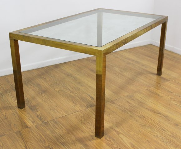 70s Brass Dining Table: With inset glass top. Approx. 29" H x 60" W x 36" D. (5113) Oxidation. Glass chipped.