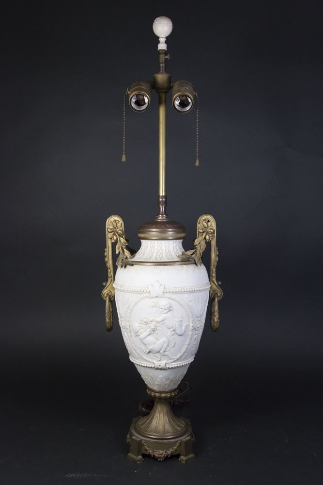 Bronze Mounted Parian Lamp: With putti decoration. Approx. 16" H. From a NJ estate. (5223)