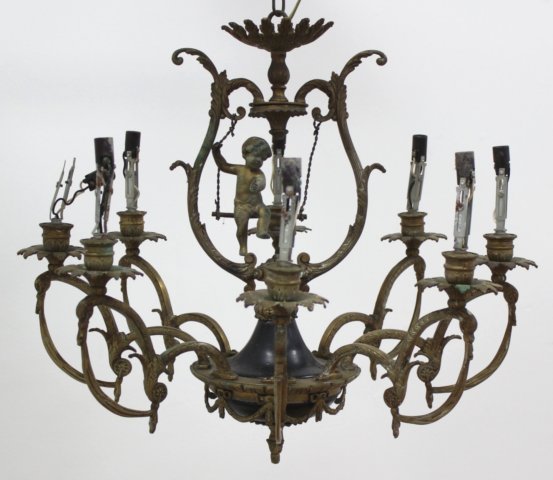 8-Light Brass Fixture with Cherub in Center: No shades. Approx. 21" H x 22" W at widest point.