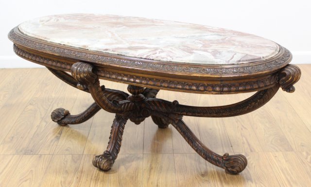 Carved Prince of Wales Style Coffee Table: Mahogany. Rouge marble top. Approx. 20 1/2" H x 50" L x 26" D.