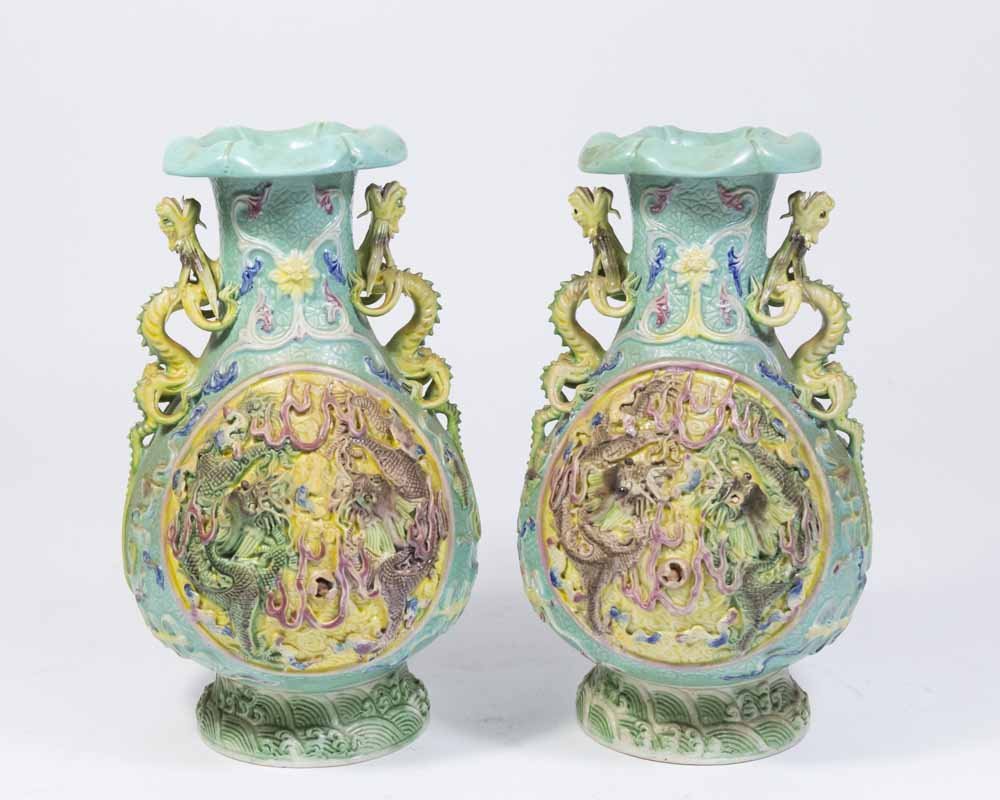 Pair Republic Chinese Porcelain Vases: With Ming mark. Raised 2-panel. Dragon motif. Movable eyes. Approx. 8 1/2" H. One eye missing. Chip on dragon handles.