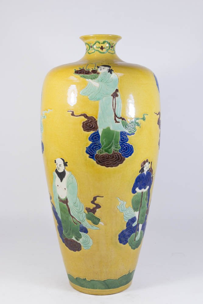 Chinese Ceramic Ochre Ground Figural Vase: Approx. 22 1/2" H. Property from the estate of Kurt Thomas.