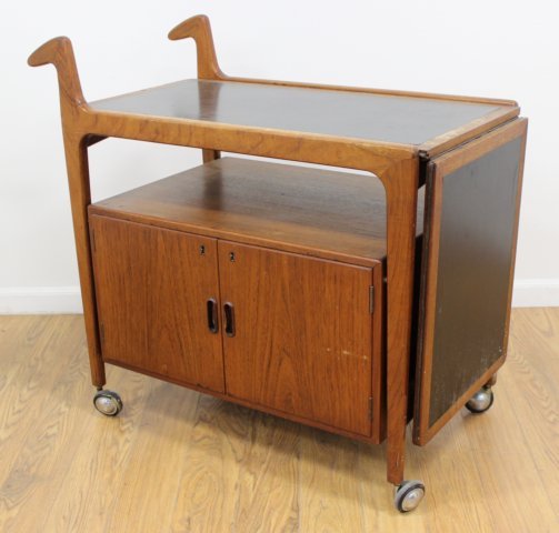 Danish Modern Teak Bar Cart: Circa 1960. Approx. 35 1/4" H x 19 3/4" W x 38" D. Some bleach spots.