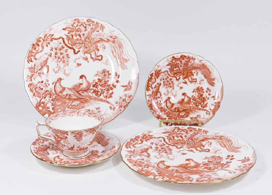 Lot 12 Royal Crown Derby Red Aves Pieces: Including cups, saucers, and dessert plates. (5277) Some hairlines.