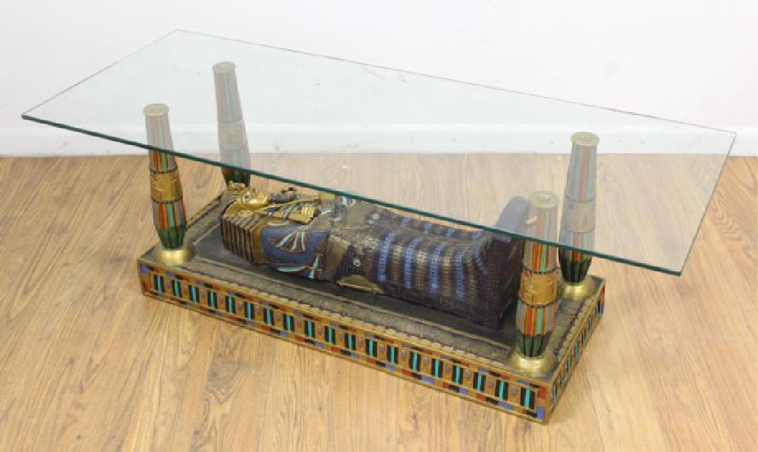 Glass Top Coffee Table with Tutenkhamen Base: Opens to sarcophagus. Approx. 18" H x 51" W x 20 1/2" D.