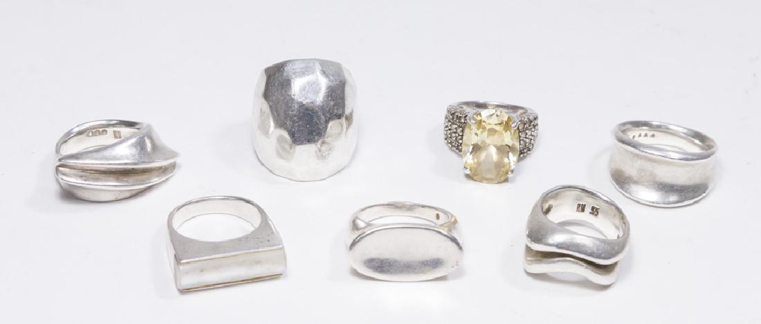 Lot of 7 Mid-Century Sterling Silver Rings: Including Robert Lee Morris. Approx. 110 grams. (5281)