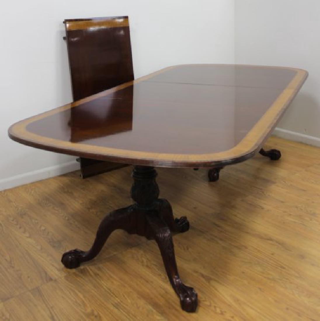 George III Style Mahogany 2 Pedestal Dining Table: Possibly by Smith & Watson. With satinwood and rosewood banding. Including 3 leaves. Approx. 29 1/4" H x 48" W x 74" L. Each leaf approx. 21 3/4" L. From a New York mansion.