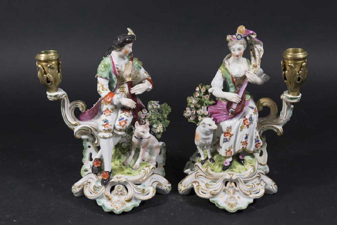 Pair Chelsea Porcelain Figural Candlesticks: Approx. 9" H. Repairs throughout on both.