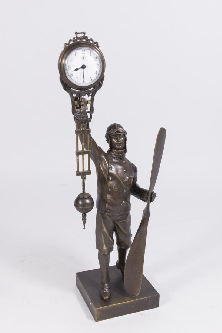 Metal Pilot Swinger Clock: Contemporary. Approx. 15 1/2" H with clock.