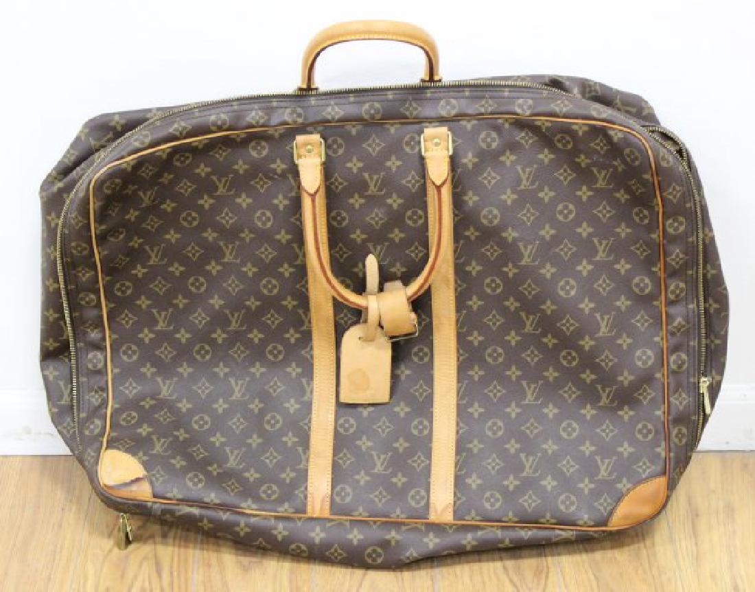 Louis Vuitton Monogram Sirius 55 Travel Bag: Vintage. With luggage tag. Approx. 16" H x 21" W x 7" D. Pre-owned condition. Stains to trim and lining. Please ask for more detailed pictures if you are interested.