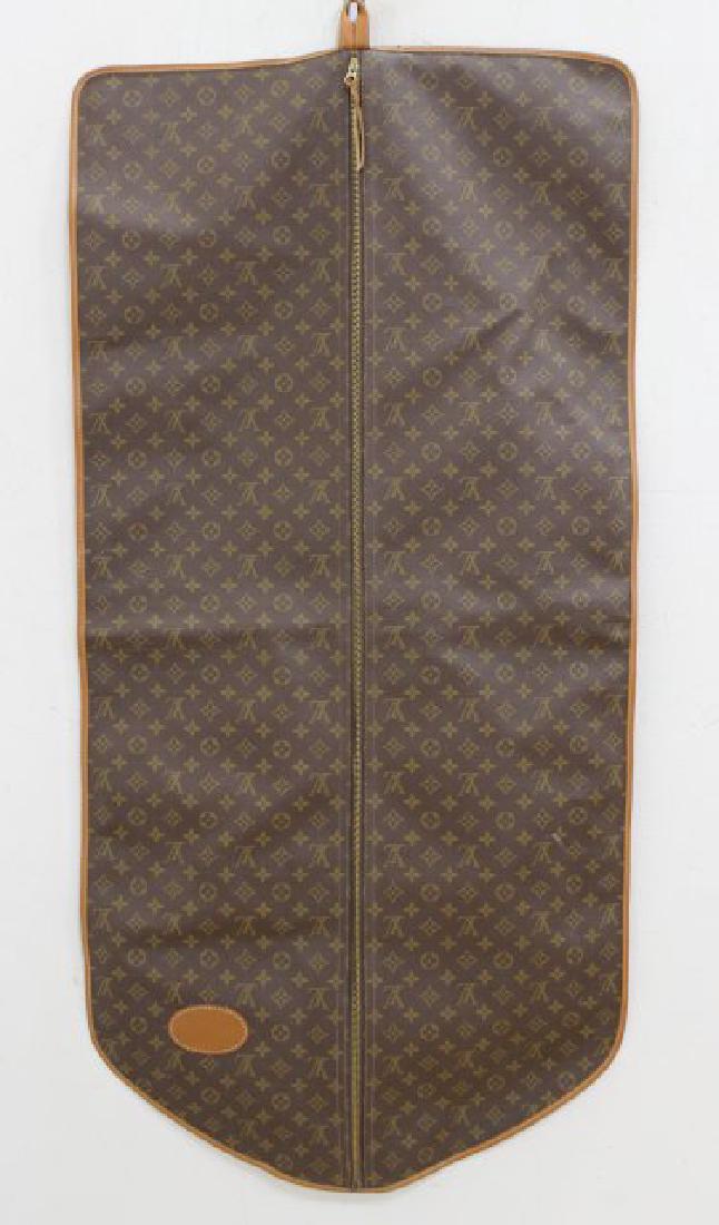 Vintage Louis Vuitton Monogram Garment Travel Bag: Made by The French Company in USA. With leather trim and zipper pull. Leather plate for personalized monogramming. Louis Vuitton label interior. Approx. 49" H x 24" W. Pre-owned condition. Few marks o