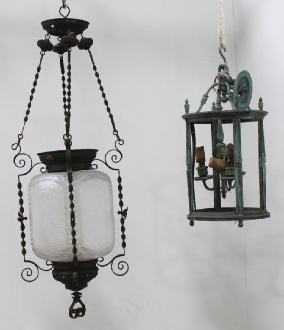2 Hall Lanterns: 1 bronze and 1 clear to vaseline glass with swirls. (030302A, SF1662)