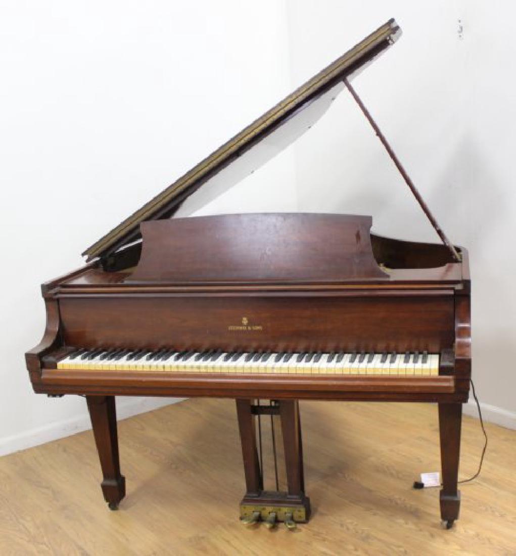 Model S Mahogany Steinway: #322663. With tuning tool. (6011) Crack in soundboard that goes with the grain.