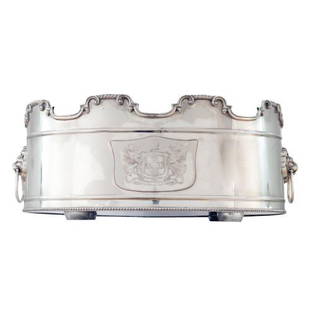 A silver-gilt wine or champagne cooler with heraldic: A silver-gilt wine or champagne cooler with heraldic insignia