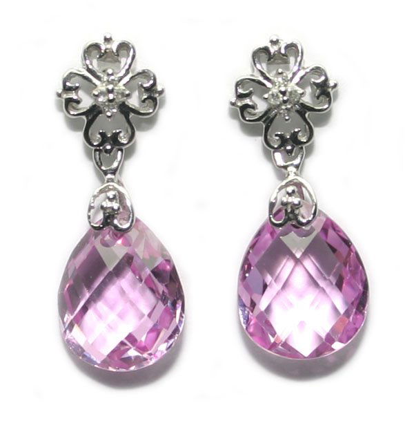 8. CT NATURAL DIA & P, TOPAZ 4 GR 10K GOLD EARRI: THESE ARE A PAIR OF 10 KARAT WHITE GOLD NATURAL DIAMOND AND PINK TOPAZ EARRINGS .THEY WEIGHT 3.45 GRAMS AND CONTAINS 8 ROUND BRILLIANT NATURAL DIAMOND AND 2 NATURAL PINK TOPAZ 12 x 10 MM IN TOTAL WEIG