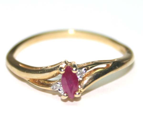 GENUINE DIAMOND & RUBY GOLD RING 10K .: THIS IS A 10 KARAT YELLOW GOLD RING WITH 2 SMALL NATURAL DIAMOND AND A MARQUISE SHAPE 5mm NATURAL RUBY IN TOTAL WEIGH OF 1.50 GRAMS , THE RING IS SIZE 7'' . Circa: Contemporary Size: 7