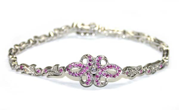 1.50 CT DIAMOND & RUBY 14K GOLD BRACELET.