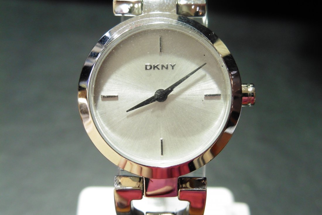 Ladies DKNY watch: Ladies DKNY watch, model number NY8540. Stainless steel. Round face with white dial silver coloured raised number markers. Bangle strap. RRP Â£89. Comes with box