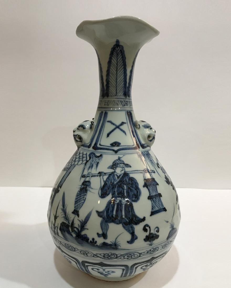 BLUE & WHITE PEAR SHAPED VASE: The vase is decorated with story in colors of blue and white. It has two monster head shaped handles on neck. The mouth is shaped as floral rim. H 14 in D 4.4 in Bottom D 4.2 in