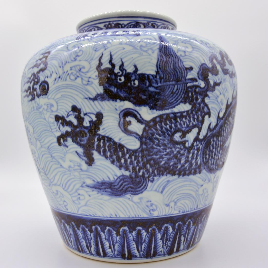 DAMING XUANDE NIANZHI MARK DRAGON JAR: With DaMing XuanDe NianZhi mark. The jar is painted with a floating dragon upon the river in colors of blue and white. H 13.75 in D 5.90 in