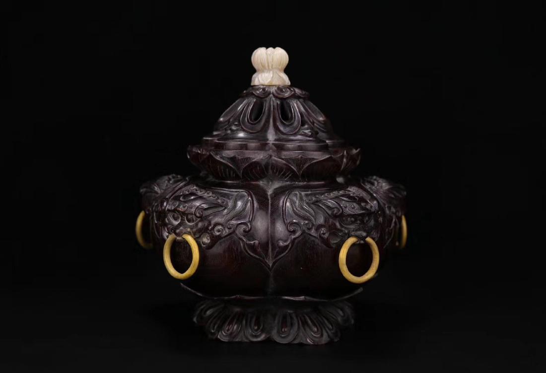 20TH CENTURY, A LOBULAR RED SANDALWOOD INCENSE BURNER,: With five-beast-ear design. lotus-shaped design. DIMENSION height 23cm; middle 21.5x21.5 cm; calibre 9.7x9.7 cm; base 13x13 cm; total weight 2.3kg