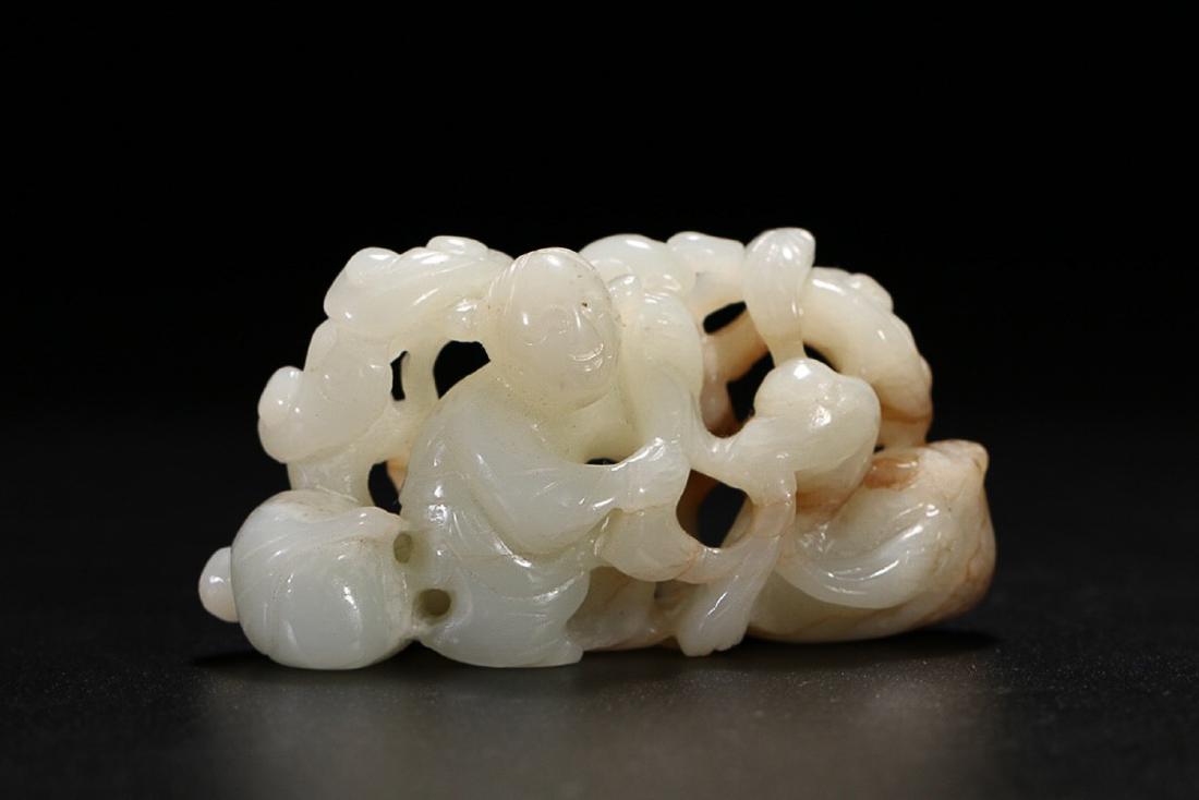 18-19TH CENTURY, A STORY DESIGN HETIAN JADE ORNAMENT,: WITH FULL APPEARANCE. THE BODY IS HOLLOWED OUT. THE STORY IS ABOUT A KID PLAYING WITH A G GOOSE. DIMENSION 8.85x4.75x3.0cm; weight 137.7g