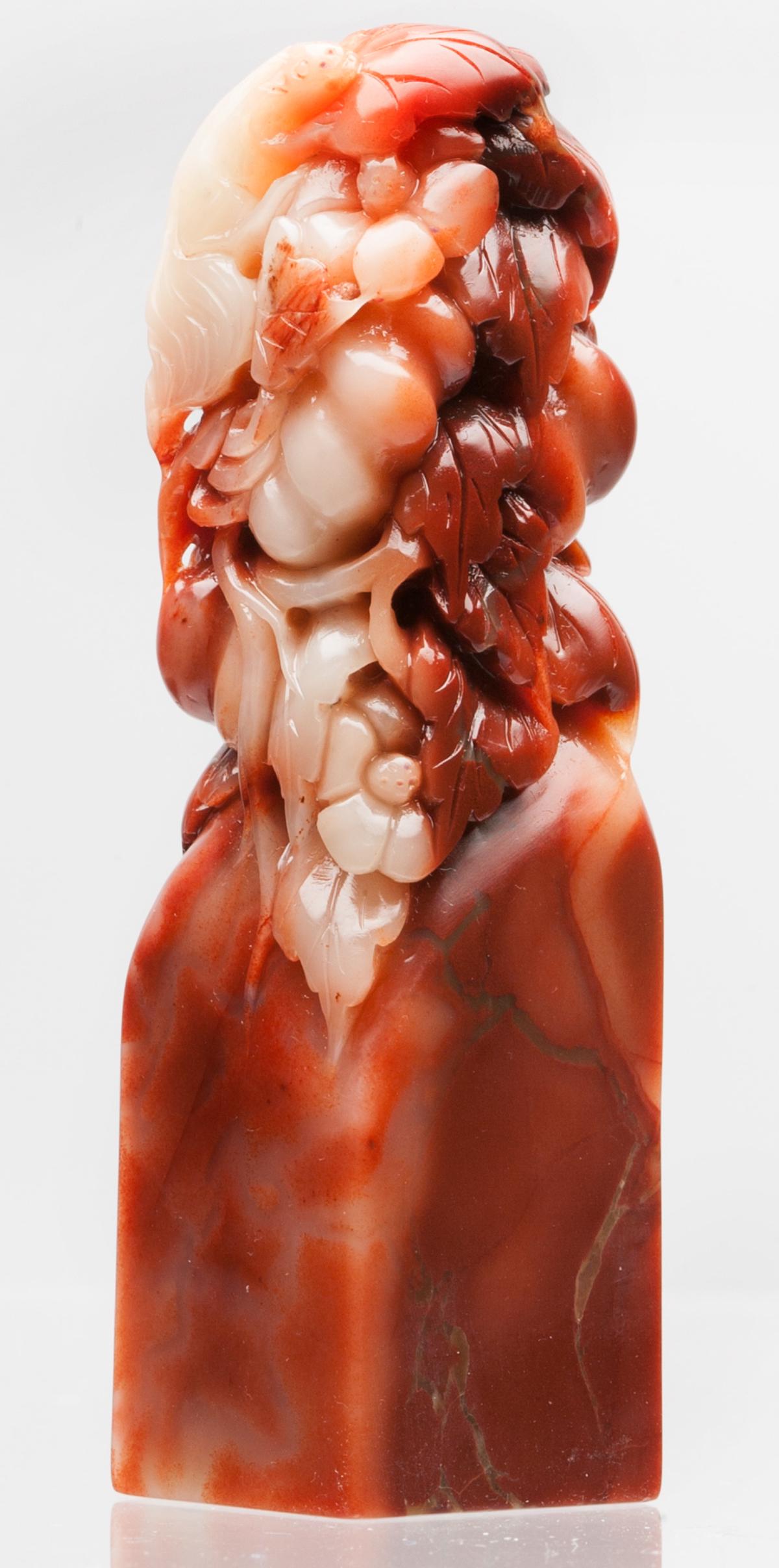 A RED FURONG SOAPSTONE SQUIRREL PATTERN SEAL: Red FuRong Soapstone Seal, carved with squirrel and pumpkin pattern. In good condition. Height 3.5 in