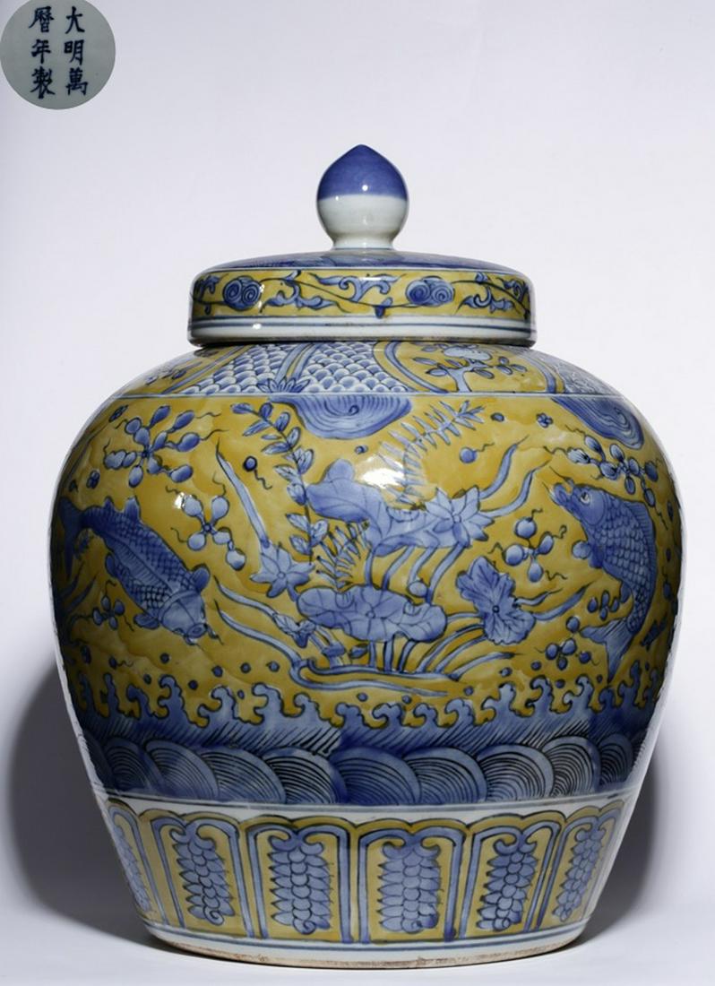 A BLUE&WHITE GLAZE JAR WITH FISH PATTERN: With DaMingWanLiNianZhi mark. Dimension 45 x 15.8 x 24 cm