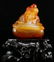 AN AGATE CARVED FIGURE SHAPED PENDANT